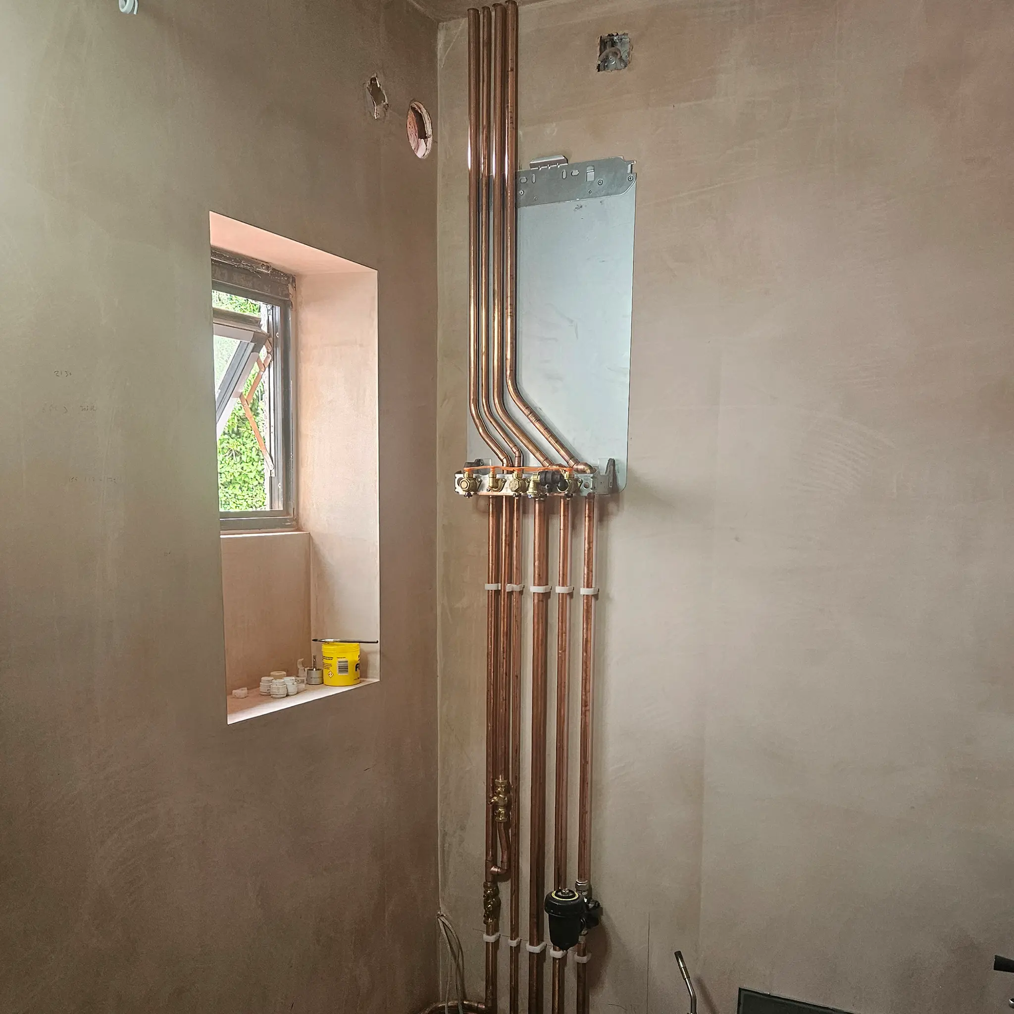 Newly laid pipework in preparation for a boiler to be installed